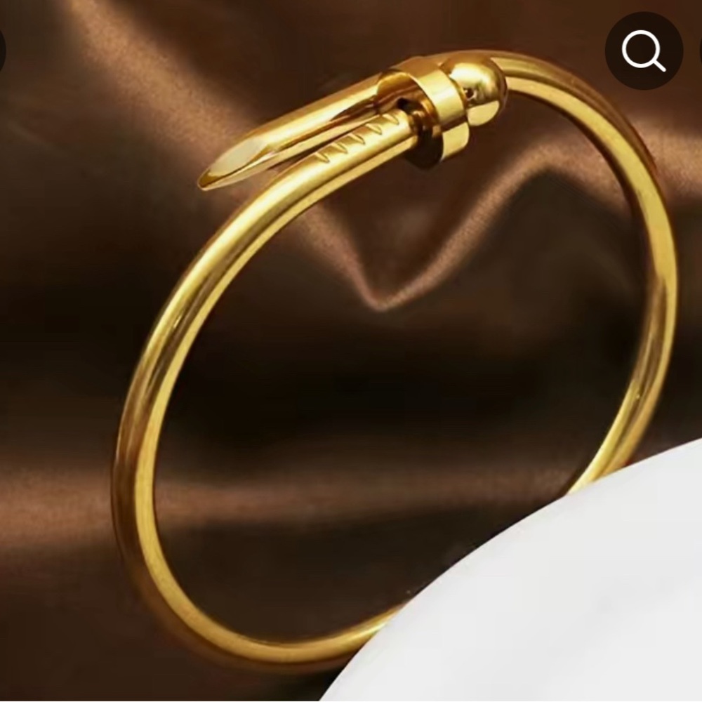 18k gold plated Open Bangle With Rotating Buckle, looks like the nail br…